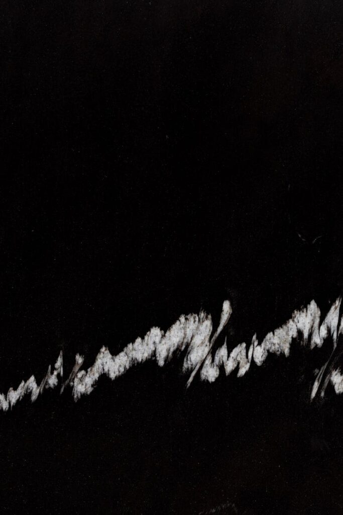 white stains on black background